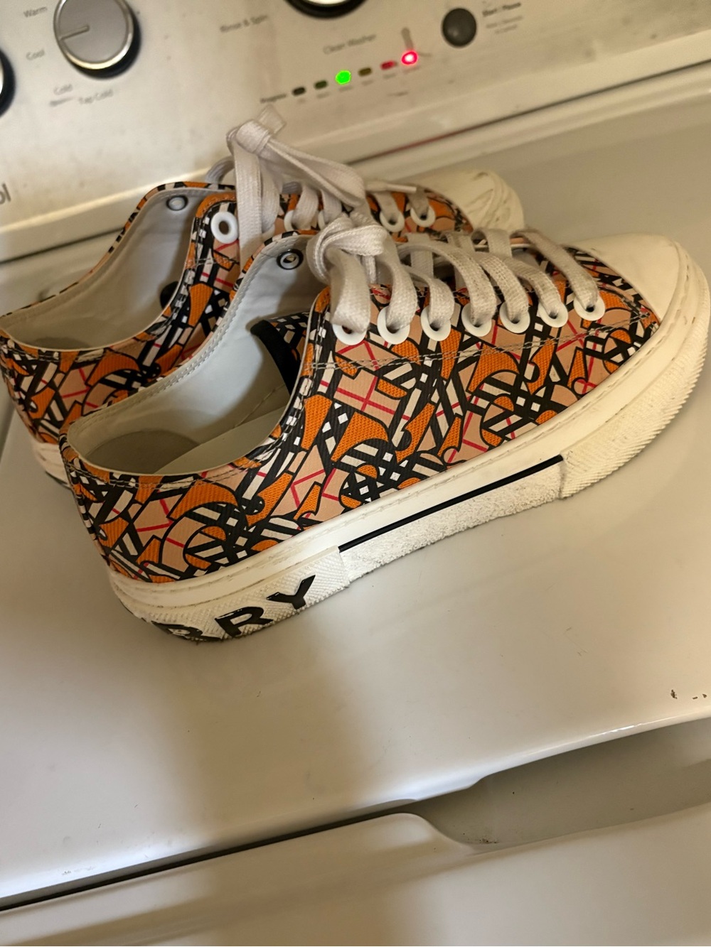 Burberry women’s Low-Top Sneakers in Orange, White and Black